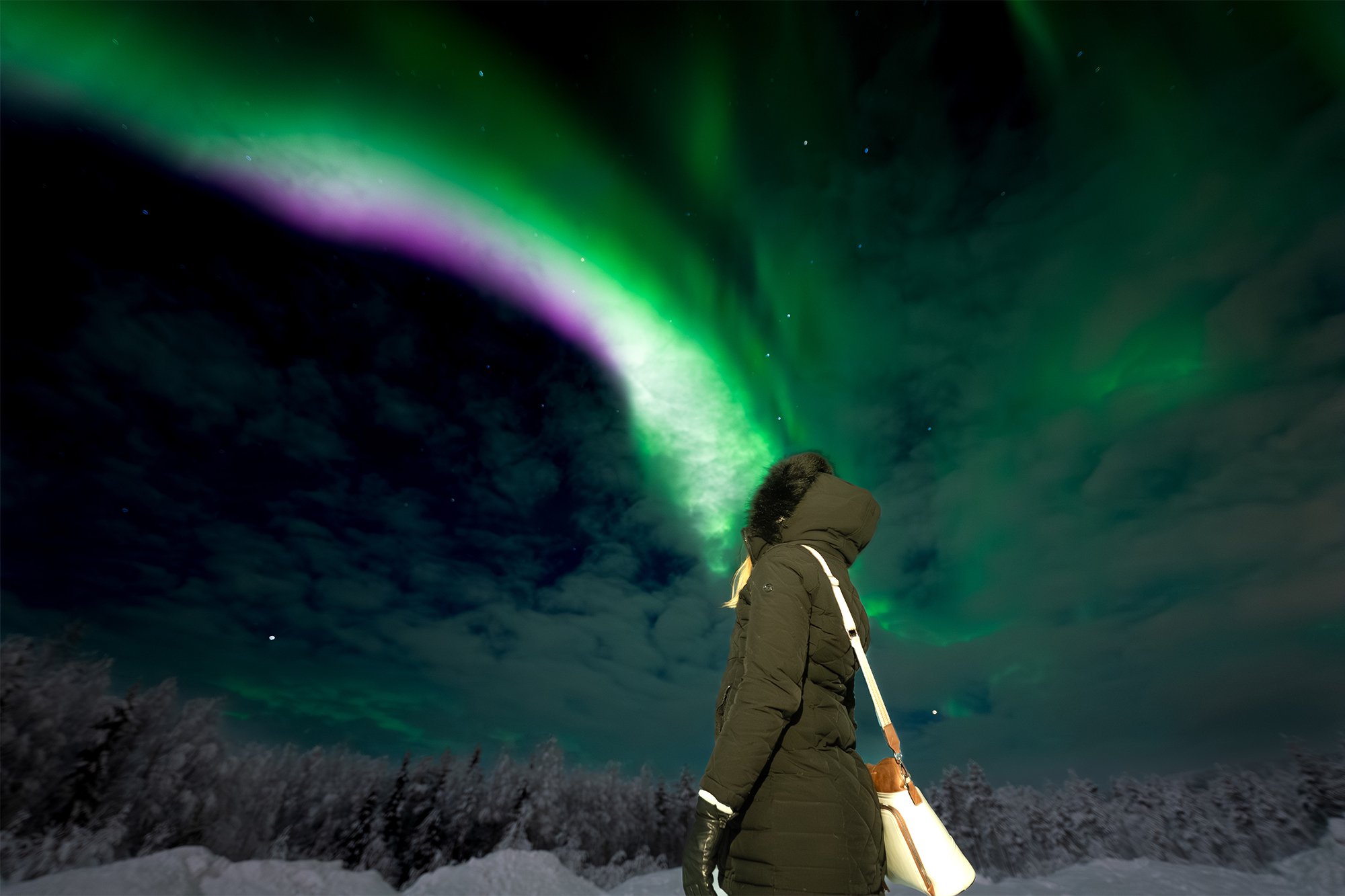 Guest witnessing the Northern Lights in March in Rovaniemi